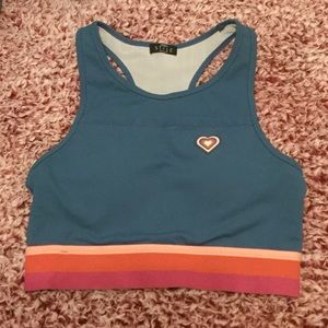 NWOT Fabfitfun sports bra teal with pink and coral stripe band Size S